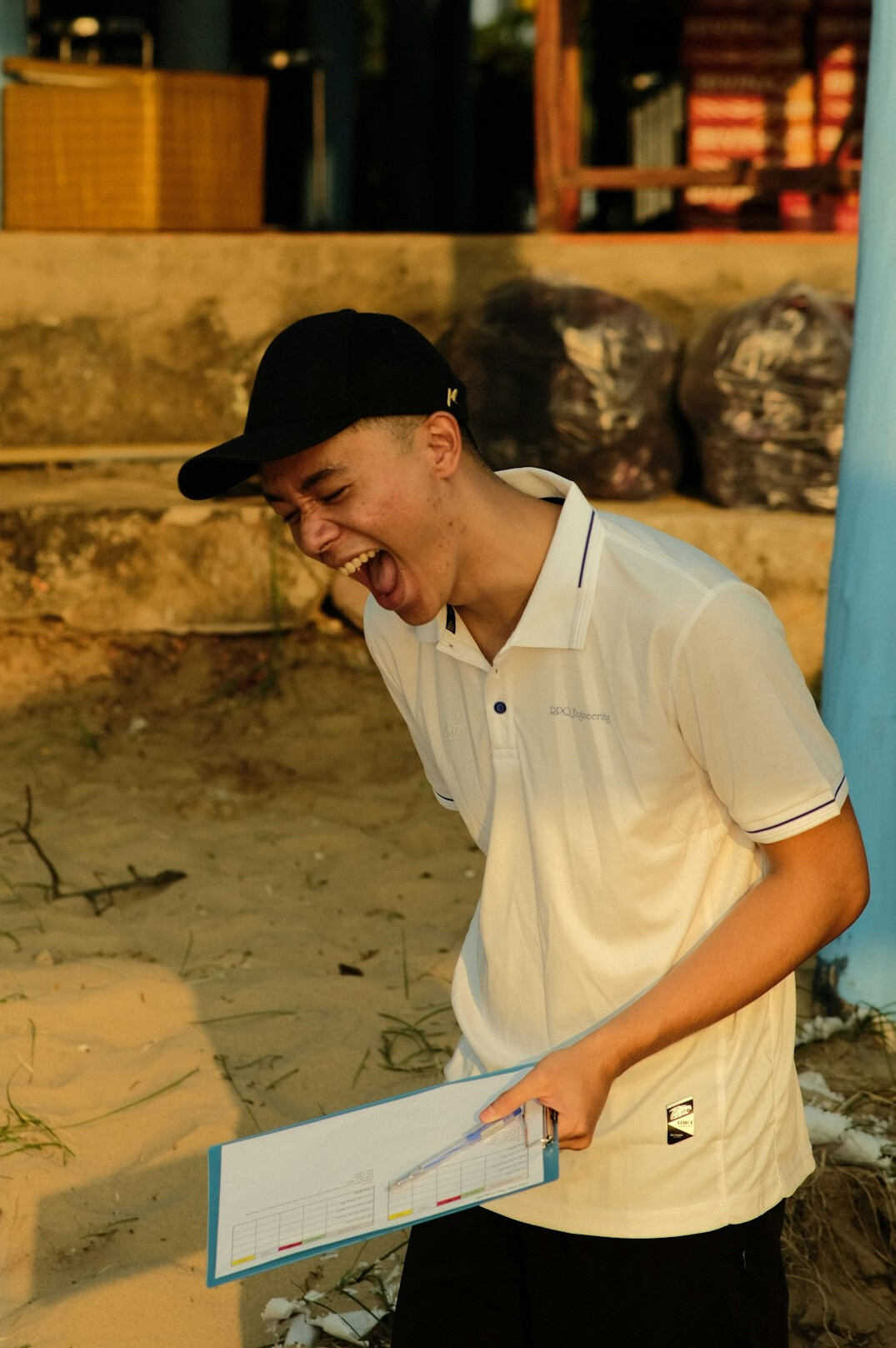 Man rehearsing a speech in front of a coach with notes